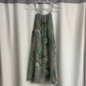 Mini, chiffon mint green dress with floral print. Thin straps that tie